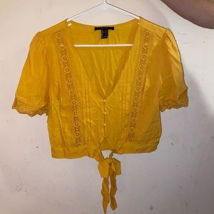 Yellow button down lightly cropped shirt